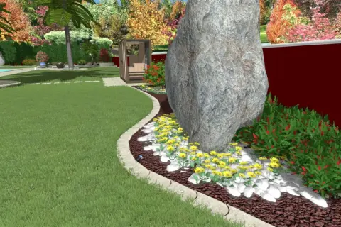Un grande masso domina un'aiuola con fiori gialli e cespugli rossi. Un'idea per un giardino grande con un tocco naturale.